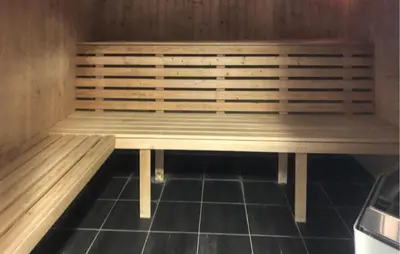 a sauna with a wooden bench in a room at Beautiful Apartment In Bjorli With Sauna in Bjorli