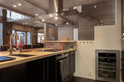 a kitchen with a sink and a stove at Fjellspa med Fantastisk utsikt og Høy standard in Aurdal