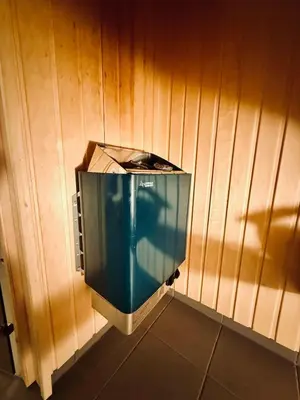 a toilet in a corner of a wooden wall at Hemsedal, Ski-in ski-out, Skarsnuten Panorama in Hemsedal