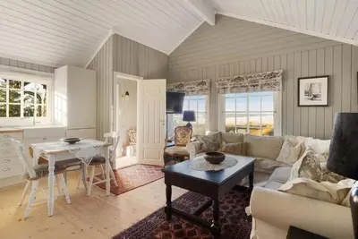 a living room with a couch and a table at Bekkeblom, family cabin with extension in Hafjell in Hafjell