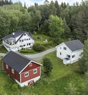 an aerial view of two houses and a barn at A Cozy Nordic Home in Ålset
