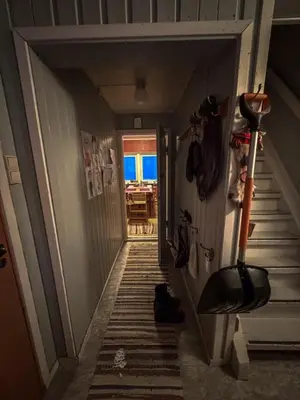 a hallway with a stairway leading to a room at Charming Norwegian Cottage in Lyngen