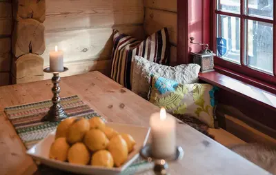 a table with two candles and a bowl of oranges at Amazing Apartment In Bjorli With Wifi in Bjorli