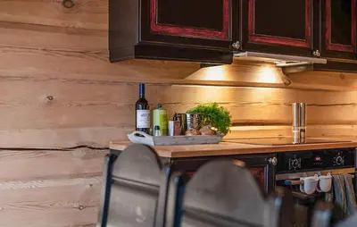 a kitchen with a counter with a bottle of wine at Amazing Apartment In Bjorli With Wifi in Bjorli