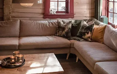 a man sleeping on a couch in a living room at Amazing Apartment In Bjorli With Wifi in Bjorli