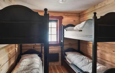 a bedroom with two bunk beds in a cabin at Gorgeous Apartment In Bjorli With House A Panoramic View in Bjorli