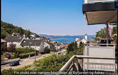 a view of a town from the balcony of a house at Newly renovated 3-room apartment in Bergen