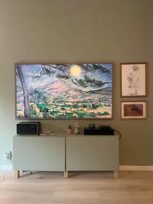 a living room with a large painting on the wall at Newly renovated 3-room apartment in Bergen