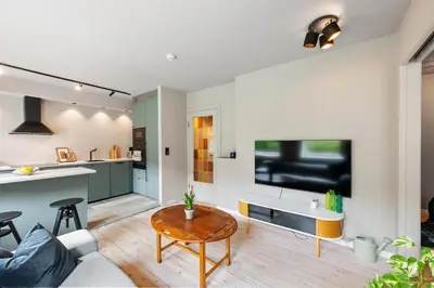 a living room with a couch and a table at Cozy Apartment in Bergen in Bergen