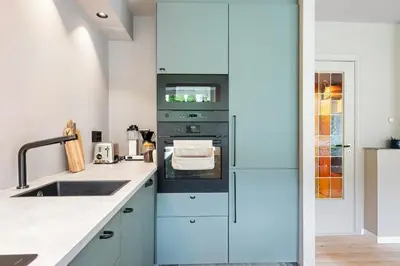 a kitchen with a sink and an oven at Cozy Apartment in Bergen in Bergen