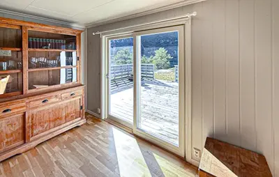 a room with a large sliding glass door with a balcony at Beautiful Home In Kvammen With House A Panoramic View in Kvammen