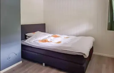 a bed with cats on it in a room at Beautiful Home In Kvammen With House A Panoramic View in Kvammen