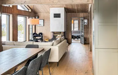 a living room with a couch and a table at Lovely Home In Bjorli With Sauna in Bjorli