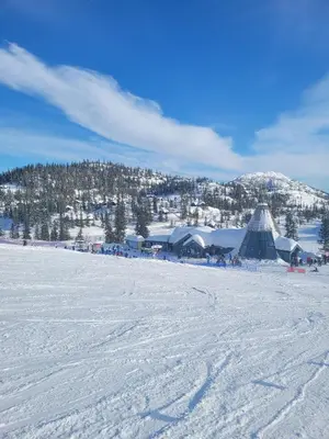 a snow covered field with a ski resort in the distance at Cozy Cabin Retreat in Fl, Norway - Perfect for Families and Nature Lovers in Flå