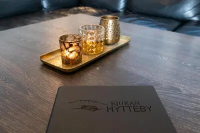 a tray with candles and a card on a table at Rjukan Hytteby in Rjukan