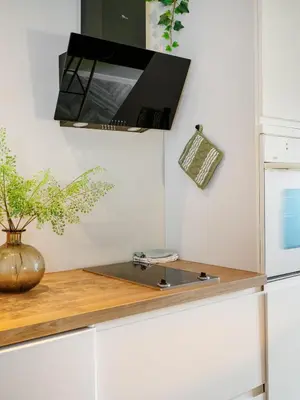 a kitchen with a counter top with a mirror at 3FF - Newly renovated studio apt in the middle of the city centre in Trondheim