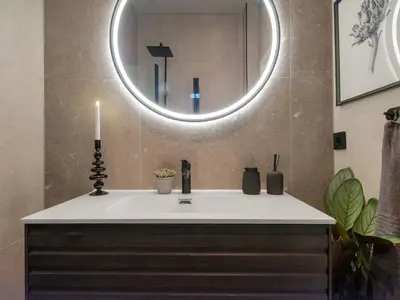 a bathroom with a sink and a mirror at 3FF - Newly renovated studio apt in the middle of the city centre in Trondheim