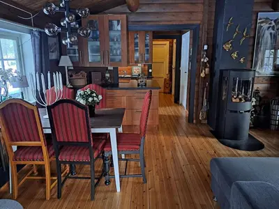 a kitchen with a table and chairs in a room at 8 person holiday home in Jordet in Jordet