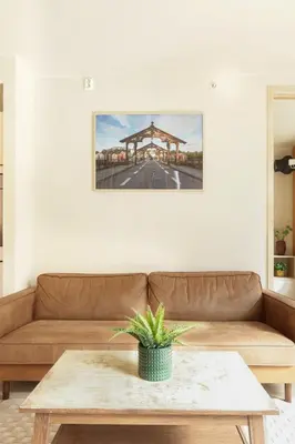 a living room with a couch and a table at Elegant 1-Bed Apt in City Centre in Trondheim