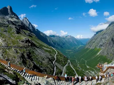 a group of people walking up a mountain at 4 person holiday home in Eidsvåg in Eidsvåg