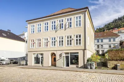 a large building on a street in a city at Perfect Location by Bryggen in Bergen