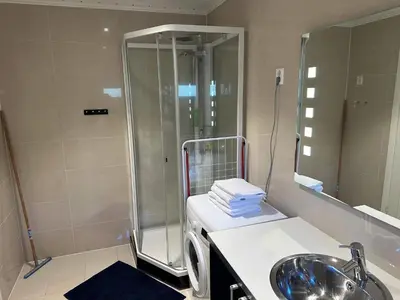 a bathroom with a shower and a sink at 4 star holiday home in Eidsvåg in Eidsvåg