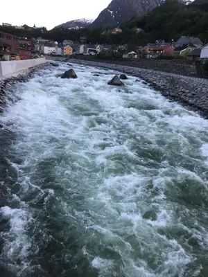 a river with white water rapids on top of it at Near Trolltunga and centre of Odda in Odda