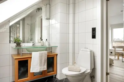 a bathroom with a sink and a toilet at Relaxed apartment with a view in Bergen