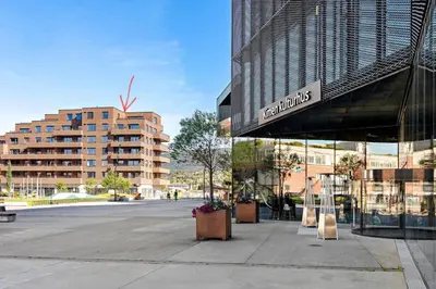 a building with a sign on the side of it at Family-friendly luxury penthhouse with three bedrooms in Stjoerdal