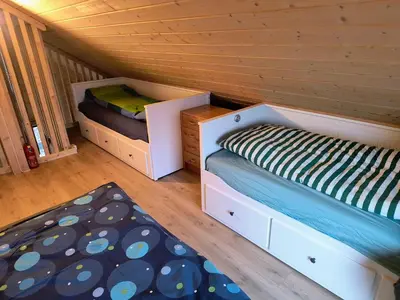 a room with two beds in a cabin at Ullabu in Gol