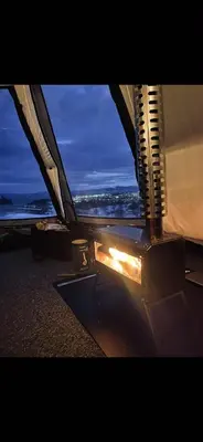 a view from inside of an airplane wing at night at Torshaug glamping in Trondheim