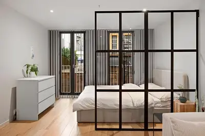 a bedroom with a bed and a white dresser at Studio apartment in city center in Bergen
