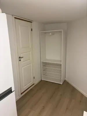 an empty room with a door and a closet at Family friendly apartment with parking in Bergen