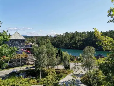 an aerial view of a house next to a lake at Haven Fortress