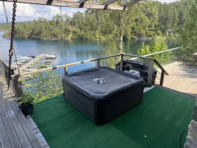 a swing on the deck of a boat on a river at Haven Fortress