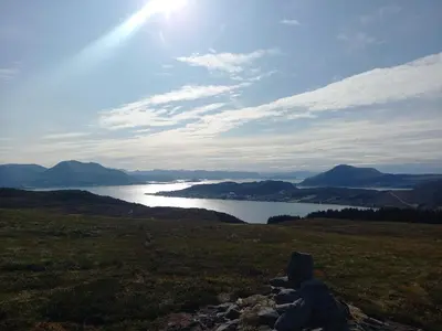 a view of a lake in the middle of a field at Unik og moderne hytte med utsikt mot havet 38 in Haram