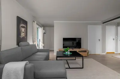 a living room with a couch and a table at Apartment in idyllic Kristiansund in Kristiansund