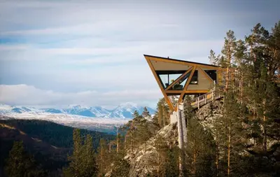 a building on the side of a mountain at Eagle Nest Eco Lodge in Sel