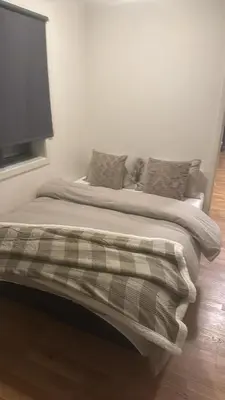 a bed with pillows on it in a bedroom at Modern apartment near Oslo in Lii