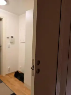a door leading into a room with a hallway at Modern apartment near Oslo in Lii