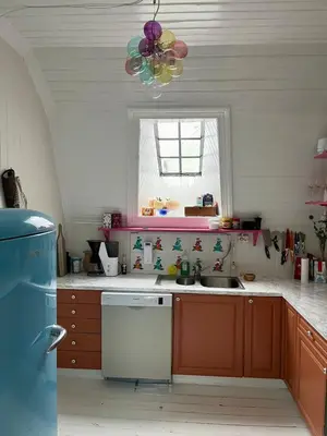 a kitchen with a sink and a window at Authentic top floor pearl in the city Center in Ålesund