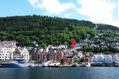 a town on the shore of a body of water at Penthouse apartment with garden and amazing view, in Bergen