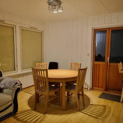 a dining room with a table and four chairs at A house for rent in Osen, only 45 min from Trysil in Åmot