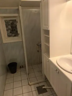 a bathroom with a shower and a sink at Holiday home Hemnskjel in Hitra