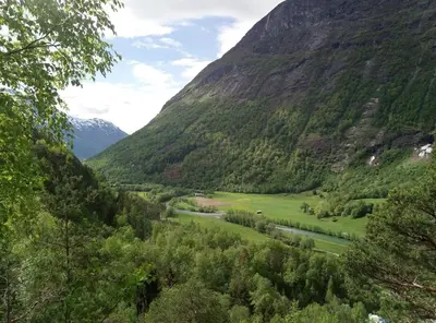 a view of a valley with a river and mountains at Hjelledalen Hyttesenter in Hjelle