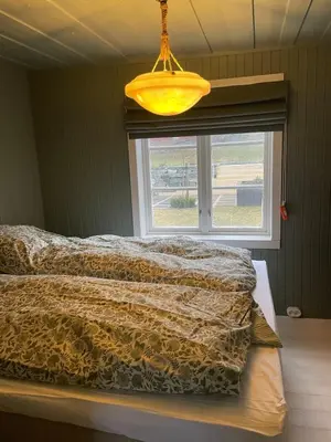 a bedroom with a bed and a window at NerSalberg Farm