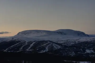 a mountain with snow on top of it at Cozy cabin in the middle of peaceful surroundings in Geilo