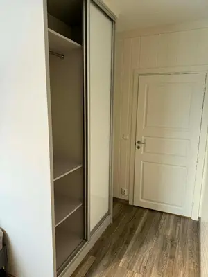 an empty closet with a mirror and a door at Large apartment, in the middle of Gol city center! in Gol