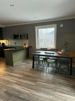 a kitchen and dining room with a table and chairs at Large apartment, in the middle of Gol city center! in Gol