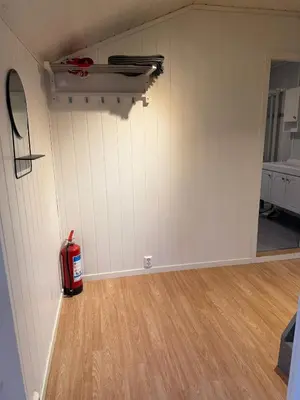 a garage with a fire hydrant sitting on the wall at Charming sea view in Bergen